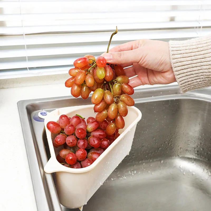 Plastic corner sink organizer with strainer