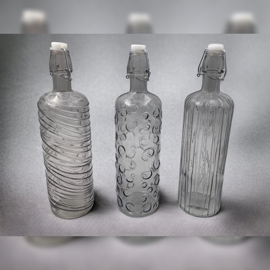 Fume Colored Glass Bottle with Embossed Designs and Herm